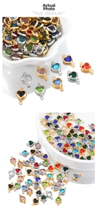 Macro shot of colorful heart-shaped crystal charms with double-hole metal connectors