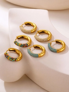 Three pairs of 4mm gold circle earrings with white zircon, colored stone, and blue bead