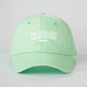 Macro detail of Mint Green California baseball cap with white embroidered text and cotton fabric