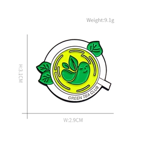 Enamel tea badge detail with dimensions 3.1x2.9cm and Green Tea Club text label