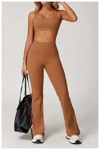 Close-up of high-waisted flared yoga pants with supportive waistband in caramel brown