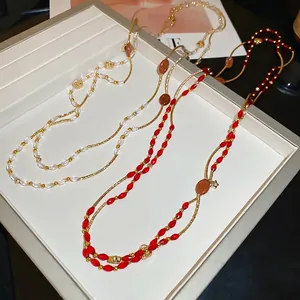Multilayer beaded necklace with crystal stones and gold chains in elegant vintage style