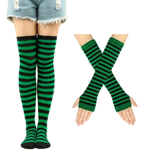 Detail of green and black striped thigh-high knit socks and fingerless arm warmer set