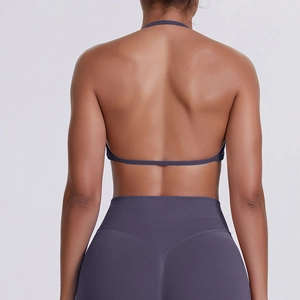 Detail view of seamless backless halter yoga bra with thin strap in deep purple finish