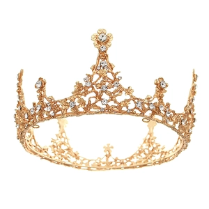Vintage golden bridal crown with intricate hollow floral patterns and sparkling diamonds