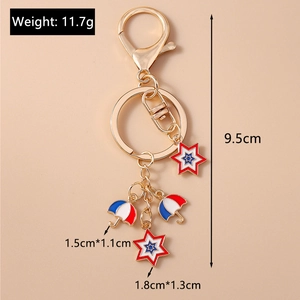 Detailed view of gold keychain with red and blue umbrella and star charms with measurements