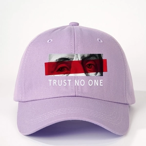 Purple adjustable cotton baseball cap featuring Trust No One eye graphic print