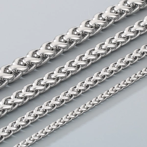 Detail view of four stainless steel chains in different thicknesses with metallic luster