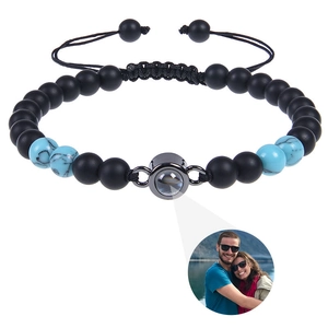 Detailed view of projection bracelet with custom photo lens and blue tiger eye beads