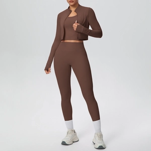Three-piece solid brown fitness set featuring a zip jacket, sports bra, and high-waist yoga pants