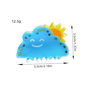 Blue acrylic hair claw with smiling cloud, sun pattern and sparkling rhinestones