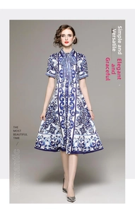 Detail of blue and white baroque print dress with elegant bow and waist-slimming design