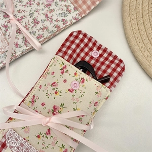 Floral patchwork eyewear pouch with lace, silk bow, and button closure detail