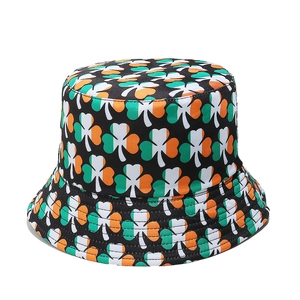 Detail of St. Patrick's Day bucket hat featuring shamrock prints in Irish flag colors