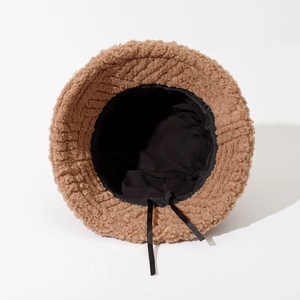Brown fuzzy lamb wool bucket hat with warm lining and adjustable ties shown in full view
