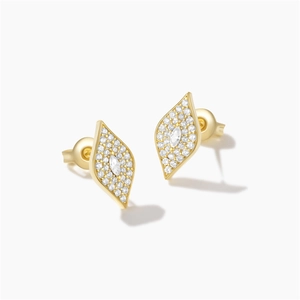 Detailed macro view of gold-plated silver earrings with pavé crystals and marquise stones