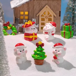 Miniature Christmas resin figurines set with bear and bunny in snow landscape
