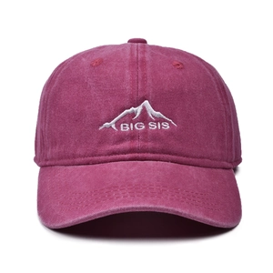 Front detail of washed magenta baseball cap with mountain and BIG SIS embroidery