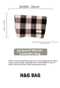 Detail view of plaid cosmetic bag with metal zipper and H&R BAG woven label