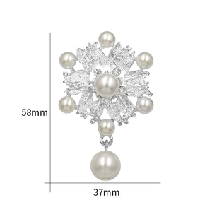 Detail view of crystal brooch with pearls and teardrop pendant showing 58mm x 37mm dimensions