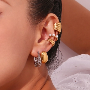 Minimalist 18K gold and silver hollow heart earrings with layered pearl ear cuffs
