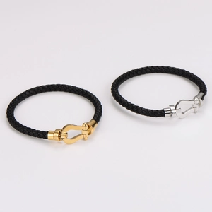 Bracciali in pelle intrecciata con fibbia a ferro di cavallo in acciaio inossidabile e oro