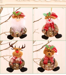 Detailed view of Christmas plush ornaments featuring Santa, reindeer, and snowman with bells