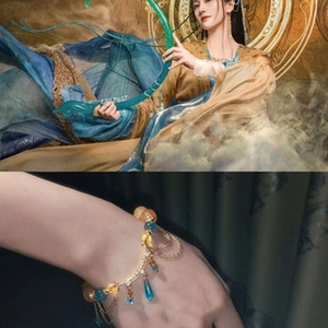 Macro detail of ancient style bracelet featuring blue beads and golden chain tassels