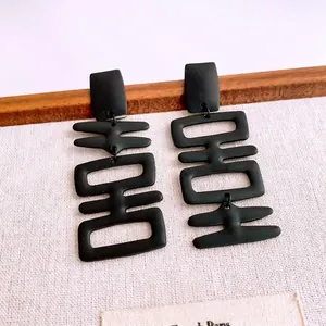 Matte black double happiness character tassel earrings with minimalist silver needle studs