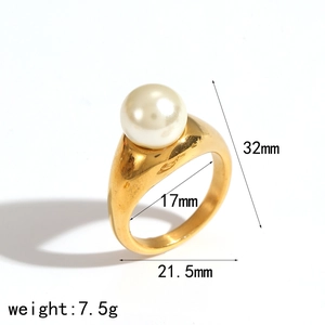 Gold-plated chunky titanium ring with white faux pearl centerpiece and dimension details