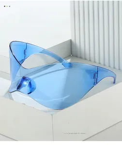 Close-up of blue wrap-around Y2K sunglasses highlighting smooth texture and futuristic design
