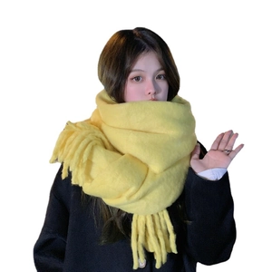 Thick yellow cashmere-feel scarf with tassels and soft knit texture for autumn winter