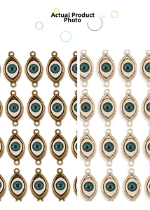 Detailed close-up of Evil Eye alloy pendants in gold and silver for jewelry making