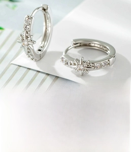 Detail of silver star hoop earrings with micro-inlaid zircon and 10mm inner diameter