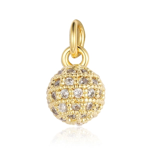 Macro detail of gold-plated spherical charm with pavé-set zircons and round bail