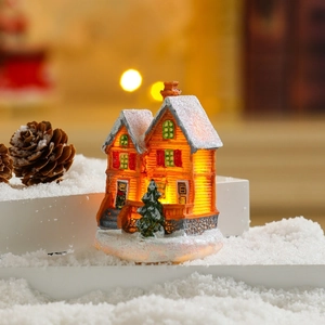 Glow-in-the-dark orange Christmas house ornament with LED light and fake snow detail