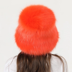 Rear view of a fluffy orange faux fur winter bucket hat showing high-quality plush texture