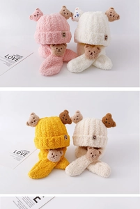 Detailed plush texture of kids winter bear hat and scarf set in multiple soft colors