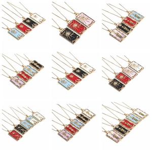 Detailed grid showing colorful vintage tarot card necklaces with gold plating and zircons