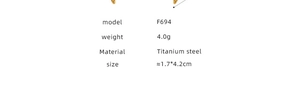 Macro detail of golden snake-shaped earrings in titanium steel showing product specs