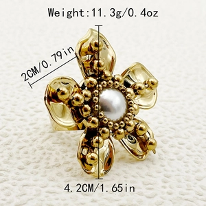 Macro detail of a gold flower ring showing dimensions 4.2cm and weight 11.3g measurements