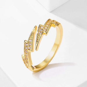 Macro view of gold lightning bolt ring with sparkling pave-set cubic zirconia crystals
