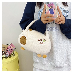 Cute plush Capybara backpack held by a model in a cozy indoor setting for women
