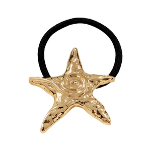 Minimalist black elastic hair tie with a textured gold starfish charm on white background