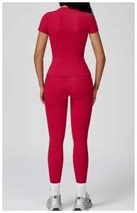 Rear view of women's red brushed yoga set featuring slim fit shirt and leggings