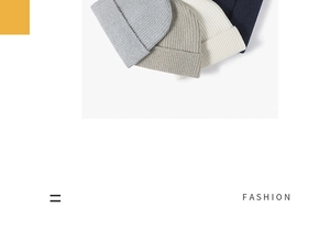 Detail view of four ribbed knit beanies in grey, beige, white and navy blue colors