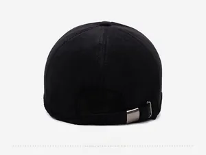 Detail view of winter baseball cap back with black corduroy texture and adjustable metal buckle