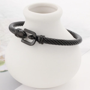 Retro stainless steel cable bracelet with black woven strap and horseshoe buckle closure