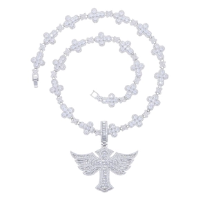 Detailed view of silver iced-out winged cross pendant and clover link tennis chain
