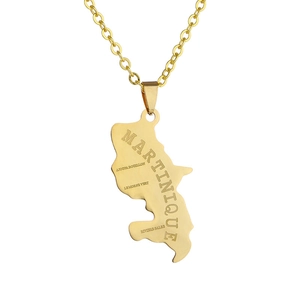 Detailed close-up of golden stainless steel Martinique map pendant with laser engraving